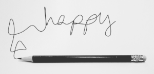 Happy written with pencil