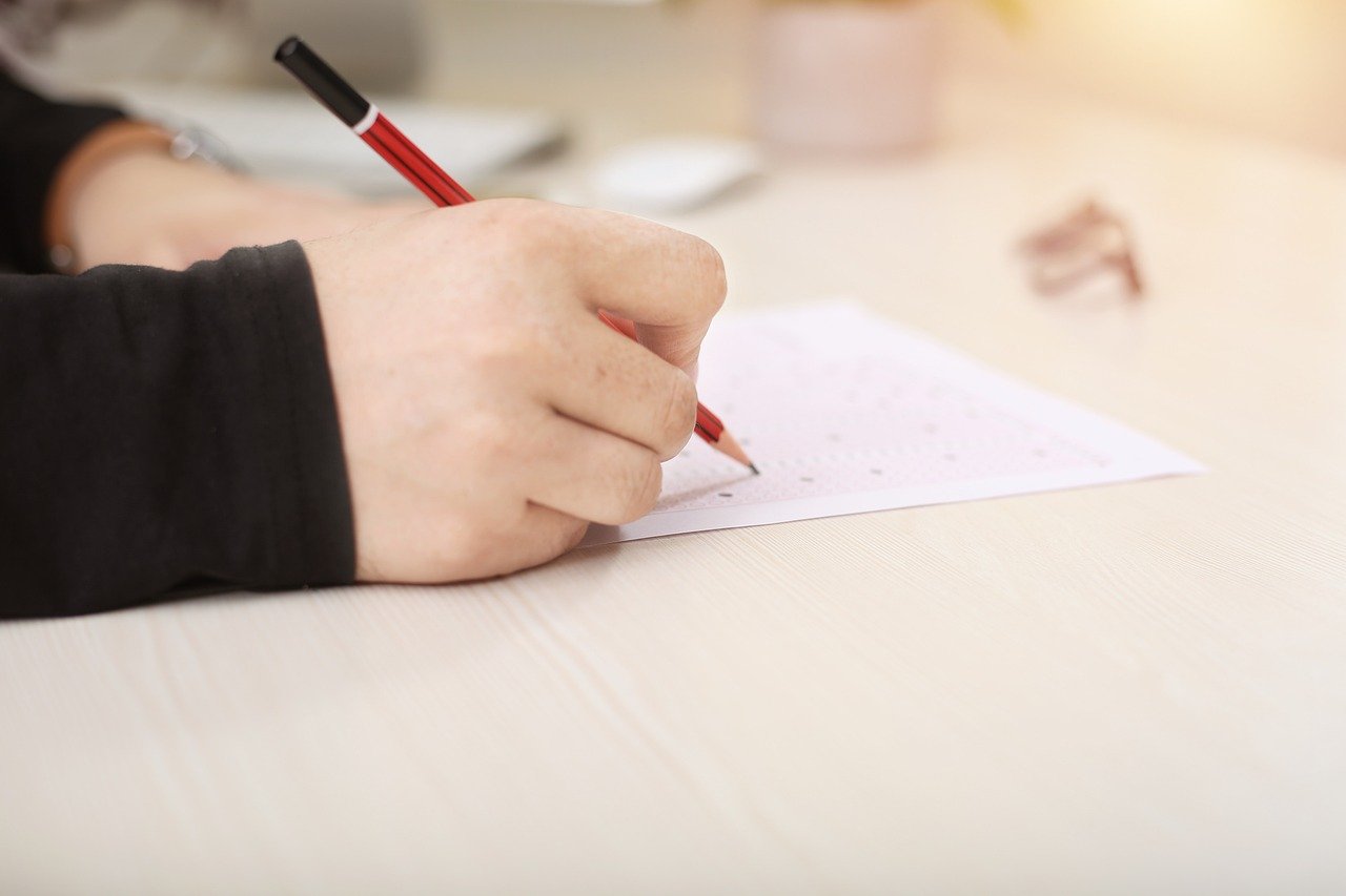 Writing on a sheet with a pencil